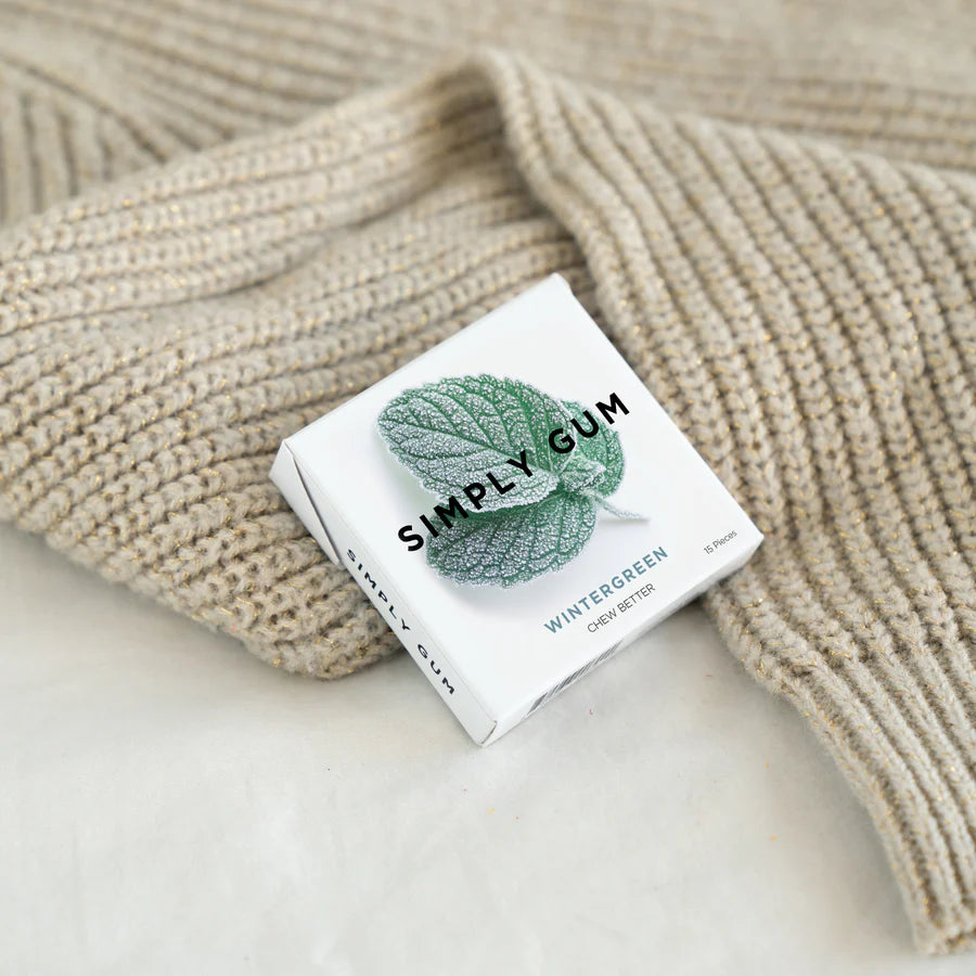 Box of Simply Gum on a textured beige surface