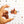 Hand holding a box of 'Simply Gum' with a maple leaf design on a light background.
