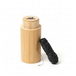 Chomp bamboo floss container with charcoal dental floss