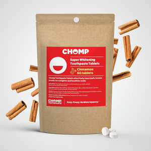 CHOMP super whitening toothpaste tablets packaging with cinnamon sticks on a light gray background