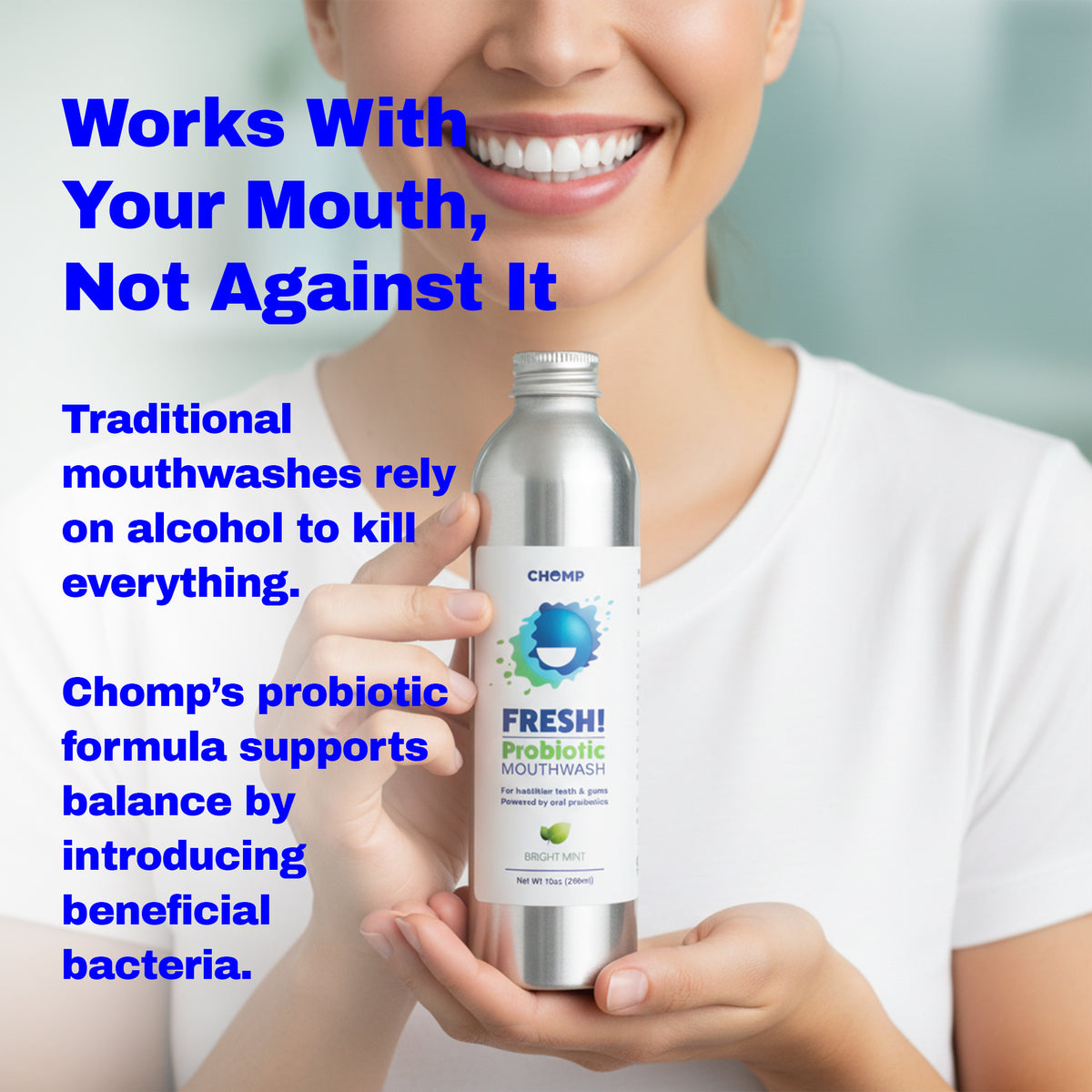 Person holding a bottle of Chomp Fresh Probiotic Mouthwash with promotional text about its benefits.