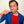 Man holding a toothbrush to his mouth against a plain background
