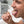 Person using a tongue scraper with text about tongue hygiene.