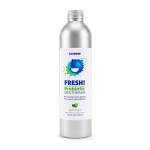A silver metallic bottle of CHOMP Fresh! Probiotic Mouthwash in Bright Mint, featuring a white label with blue and green branding, set against a plain white background.