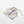 Beige drawstring bag with 'CHOMP' branding on a bathroom counter.