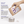 A hand holds a kraft paper pouch of Stumout oral hygiene product above a small metal tin filled with white tablets, with three tablets spilled beside it. Blue text on the left lists ingredients: nano hydroxyapatite, malitol, and calcium stearate.