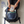 Man packing chomp mints into backpack.