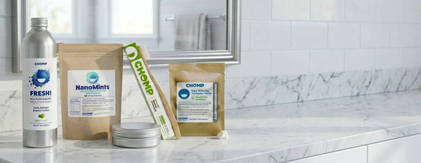 Cosmetic products on a bathroom counter with a mirror in the background