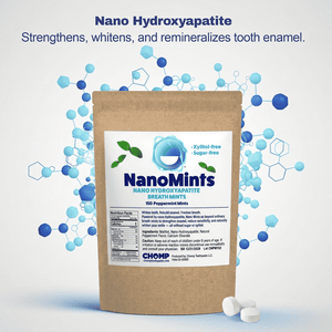 A kraft paper pouch of NanoMints breath mints with a white label, shown on a light gray background with blue molecular graphics and text. Two white mints are placed in front of the pouch.