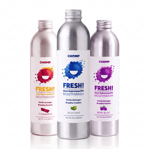 Three silver bottles of CHOMP Fresh! mouthwash displayed on a clean white background. The bottles represent three flavors: Cinnamon (red label), Brightant (silver label with blue splash), and Berry Blast (purple label).