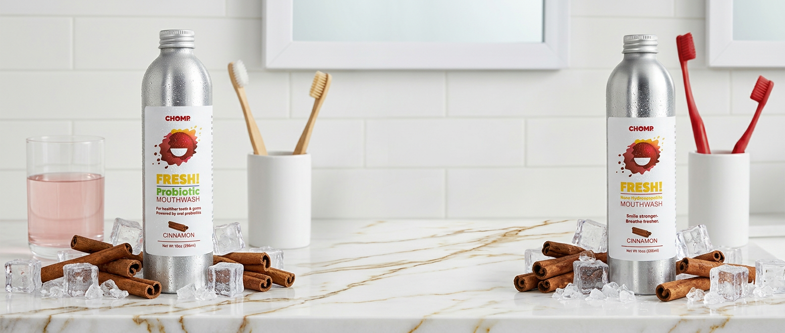 Two bottles of Colgate Plax Fresh Mint mouthwash on a kitchen counter with cinnamon sticks and ice cubes.