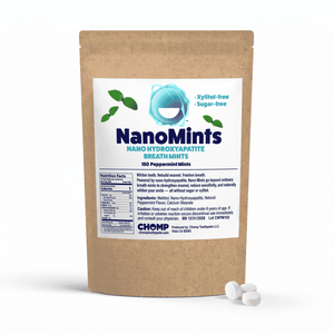 A stand-up kraft paper pouch of NanoMints breath mints with a white label, shown on a white background with three white round mints in front.
