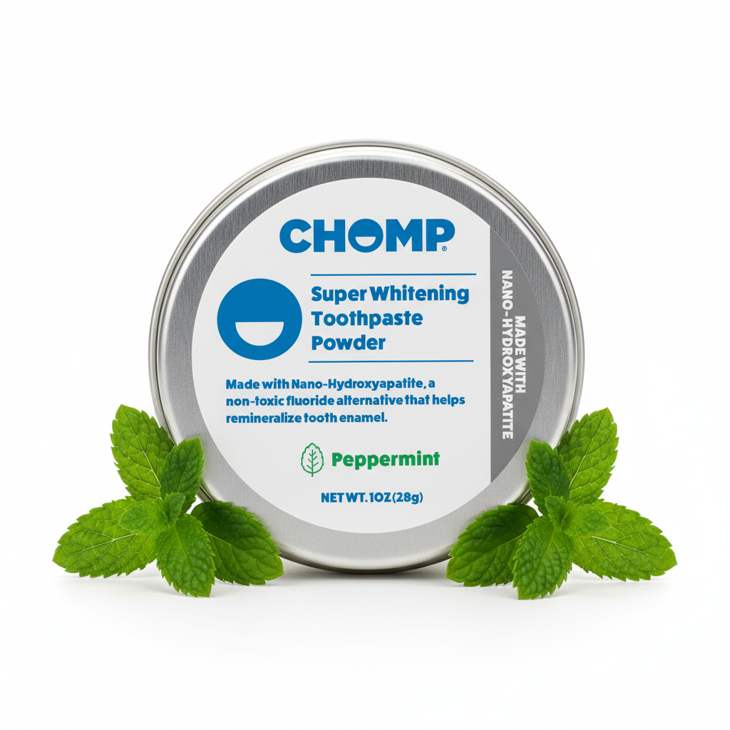 CHOMP super whitening toothpaste powder tin with peppermint leaves on a white background