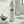 Silver bottle of Chomp Fresh Probiotic Mouthwash on a bathroom counter.