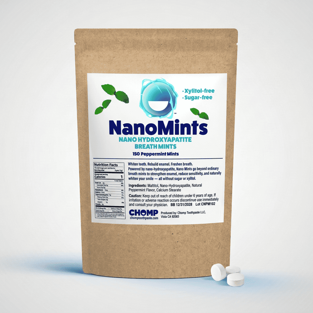 A stand-up kraft paper pouch of NanoMints Breath Mints with a white label, shown on a light gray studio background with two white round mints in front.