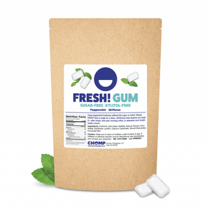 A kraft paper stand-up pouch of Fresh! Gum peppermint sugar-free gummies, shown on a white background with two white gummies and mint leaves.