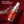 Chomp cinnamon fire breath spray with water splash on a red background