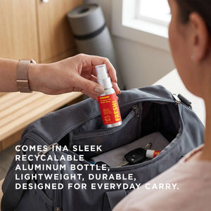 Person opening a suitcase with a spray bottle, with text about a recyclable aluminum bottle.