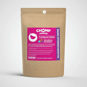 Chomp Junior toothpaste tablets packaging with berries on a white background