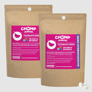 Two packages of CHOMP Junior toothpaste tablets on a white background