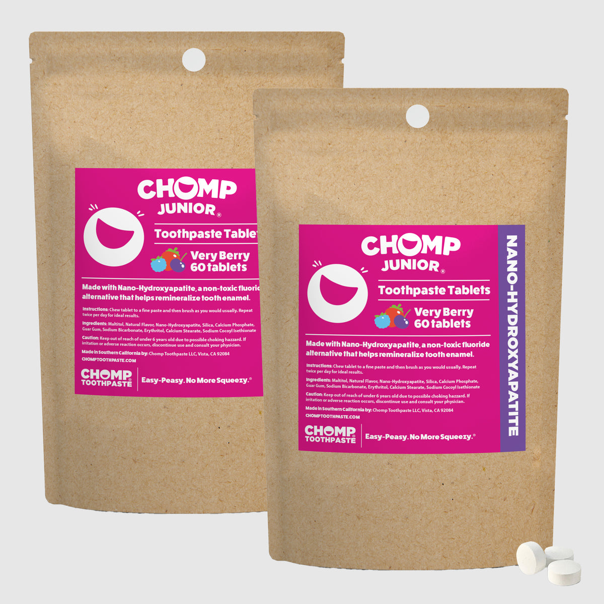 Two packages of CHOMP Junior toothpaste tablets on a white background