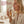 Woman using a dental spray with text about fresh breath and reduced sensitivity.