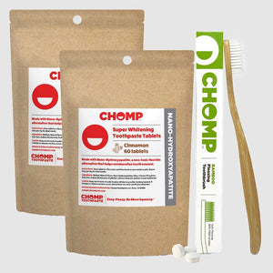 CHOMP toothpaste tablets packaging with a toothbrush on a light gray background