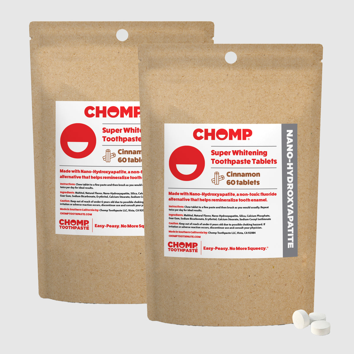 Two packages of CHOMP Super Whitening Toothpaste Tablets on a light gray background