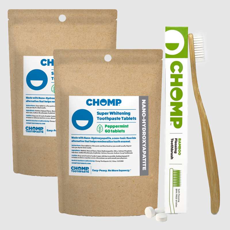 CHOMP toothpaste tablets packaging with a toothbrush on a white background