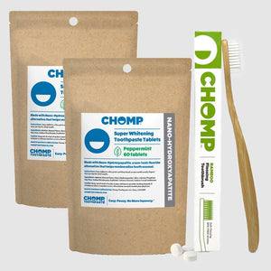 CHOMP toothpaste tablets packaging with a toothbrush on a white background