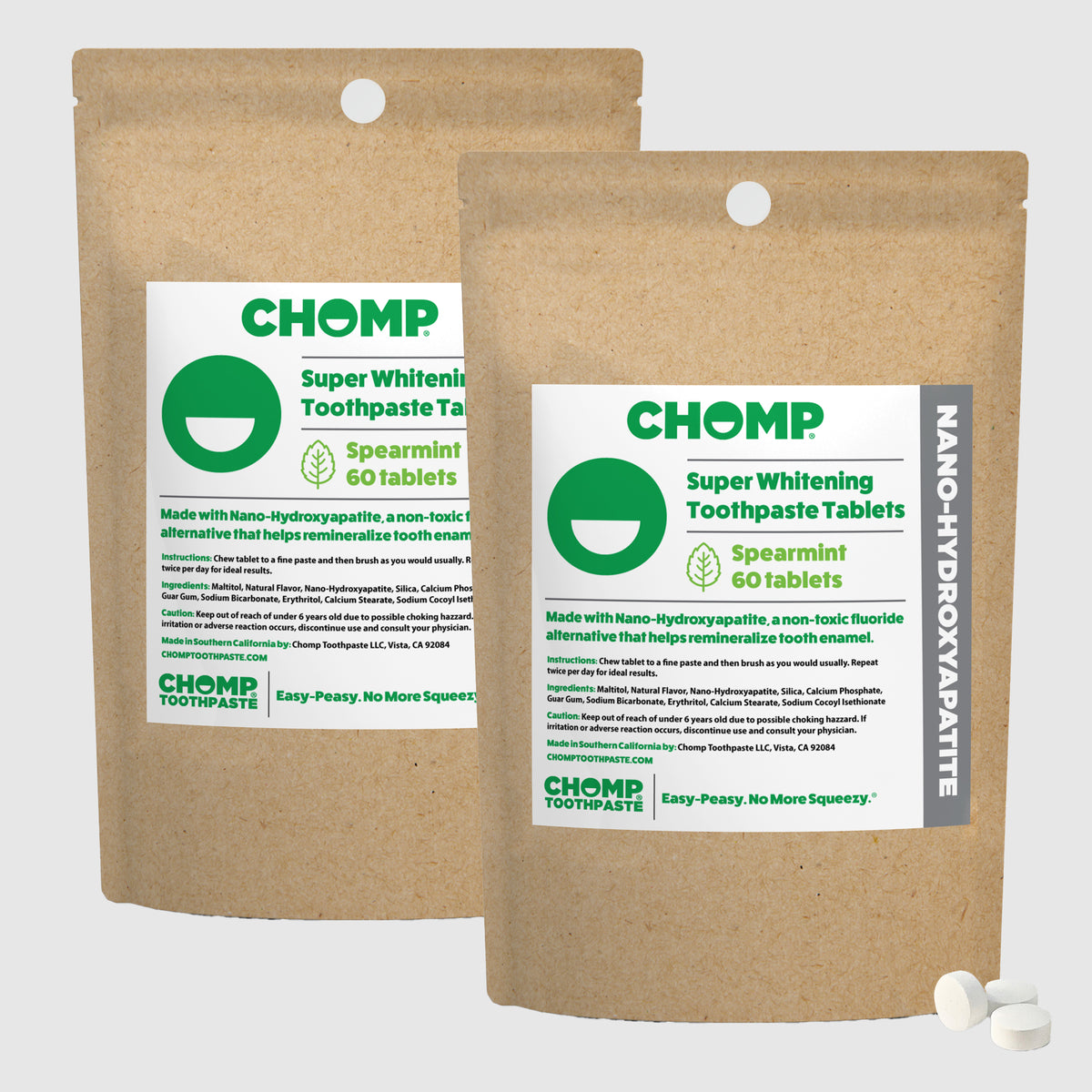 Two packages of CHOMP Super Whitening Toothpaste Tablets on a white background