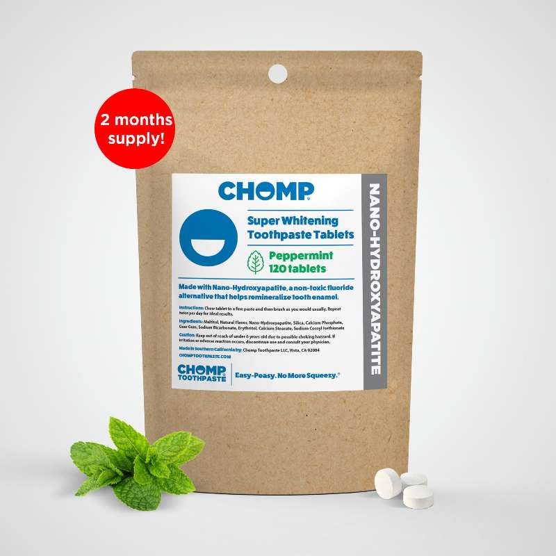 CHOMP Super Whitening Toothpaste Tablets packaging with a mint leaf on a white background
