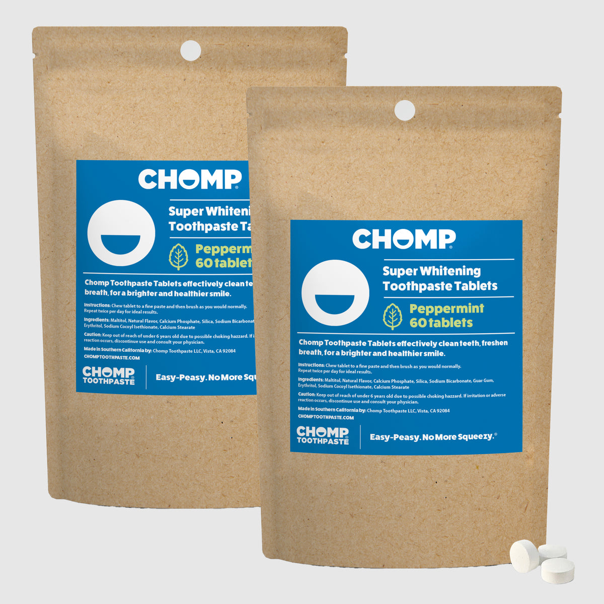 Two packages of CHOMP Super Whitening Toothpaste Tablets on a white background