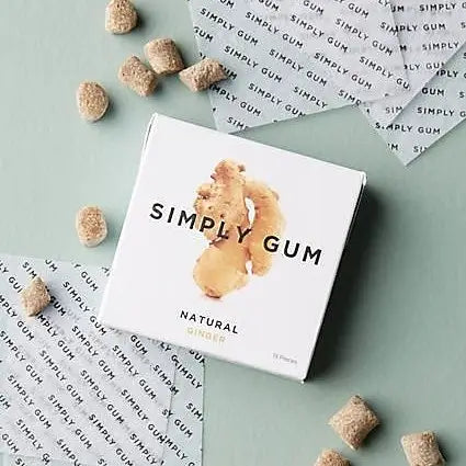 Box of Simply Gum with scattered pieces on a light green background