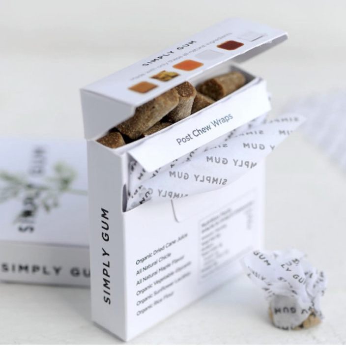 Open box of Simply Gum Post Chew Wraps with a single wrap on a white background